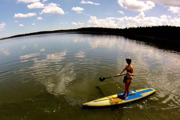 Girl standing on the Hobie Apex SUP on the water