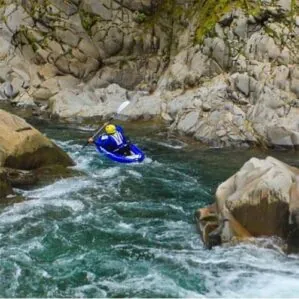 Image of the Aquaglide Klickitat kayak going down the river.