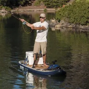 Man fishing off the Aquaglide Blackfoot paddleboard image