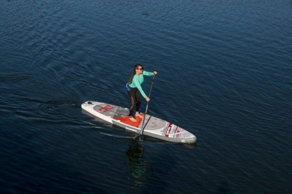 Aquaglide Cascade 12' iSUP with paddler on the water.