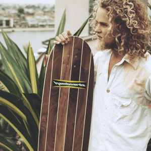Hamboards Logger loongboard standing with long haired man.
