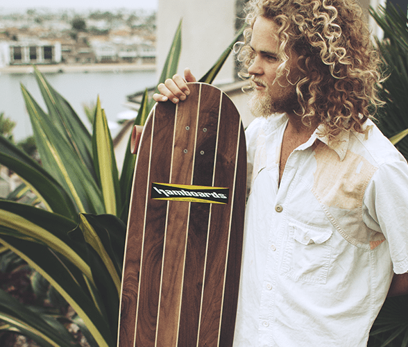 Hamboards Logger loongboard standing with long haired man.