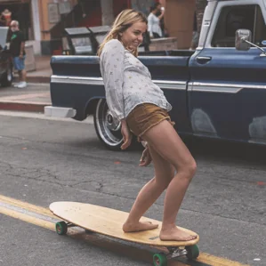 A gril on a Hamboards Pinger cruising the street image