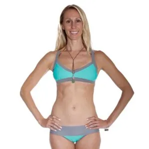 Front view of a woman wearing a Local Honey Sarah slate and mint colored bikini top