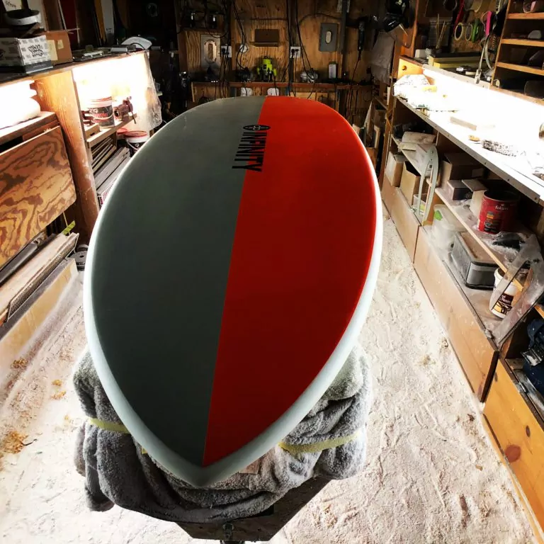 Infinity SUP Wide Aquatic bottom in orange and gray front view designed by Steve Boehne.