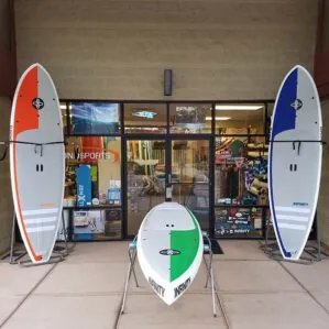 New Infinity Wide Aquatic All Around and Touring paddle boards in front of Riverbound Sports.