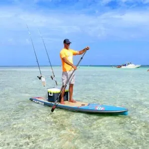 JP Australia Outback rigged for fishing with paddleboard on the water.