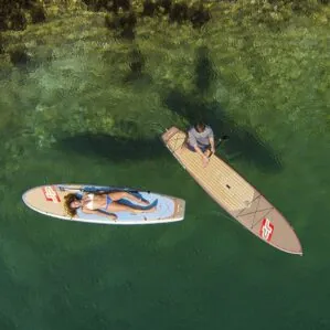Two paddlers relaxing on their JP Australia Outback paddleboards