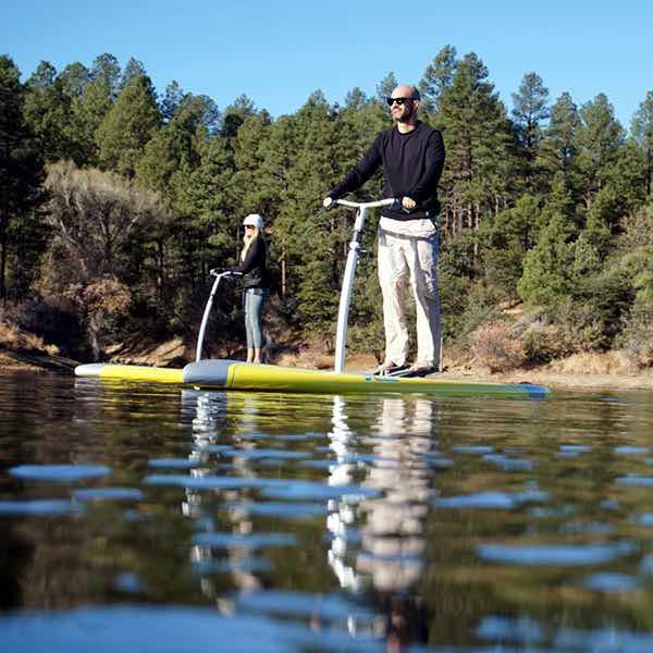 Two people on the the lake with the two solar yellow Hobie Eclipse. in Prescott, Arizona.
