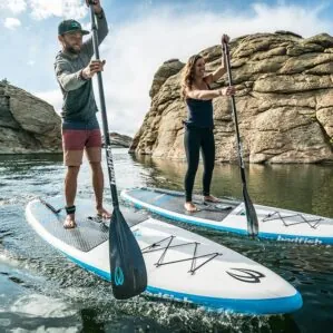Badfish SUP Monarch with paddlers on the water.
