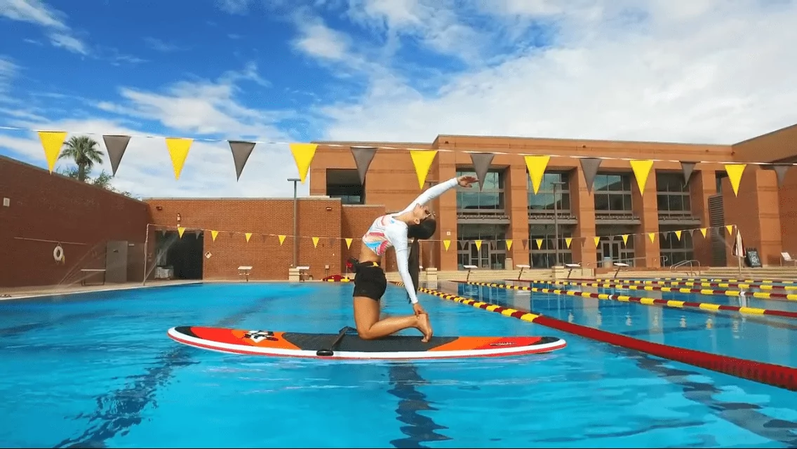 Suzi practicing SUP Fitness on her Hobie at the pool.