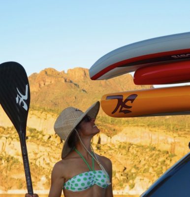 Suzi double checking her gear before paddling