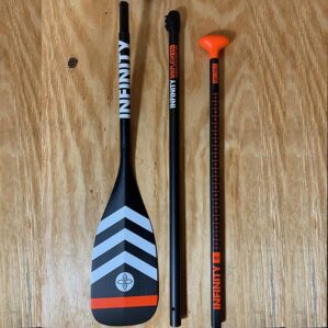 Infinity SUP Whiplash Carbon 3 piece travel paddle with orange and white strips