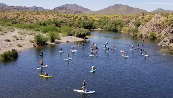Group paddle down the Salt River in Mesa, Arizona with Riverbound Sports SUP rentals.