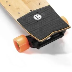 Evolve Skateboards Stoke with orange wheels kick tail.