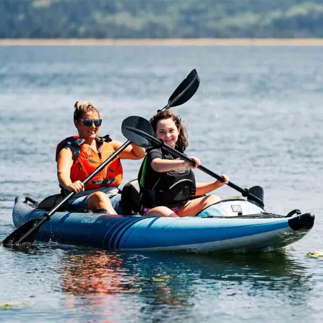 Aquaglide Chelan 140 on the lake with kayakers.