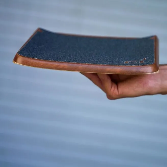 Profile view of Future Motion OneWheel Surestance Footpad with black grip tape.