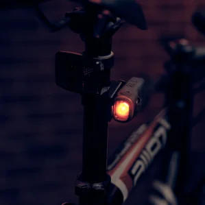 ShredLights red tail light SL200 on the seat post of a bike.