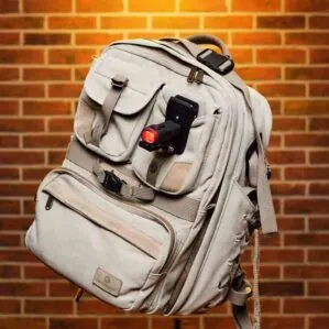 ShredLights Action clip mount with SL-200 red LED light on a backpack.