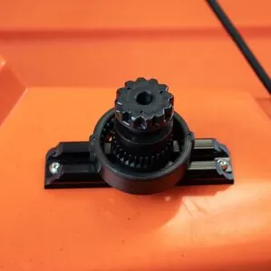 YakAttack track in black mounted on orange kayak.