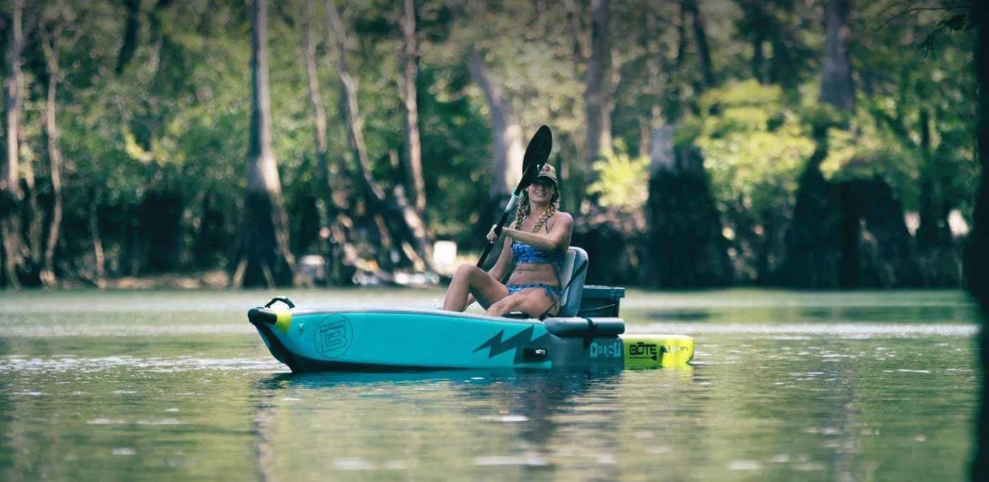 A women paddling the native citron Bote DEUS sit-on-top kayak and SUP. Available at Riverbound Sports in Tempe, Arizona.