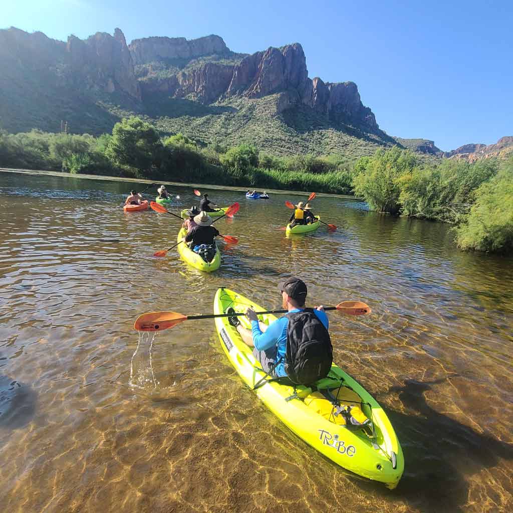 A group of kayakers paddling the Salt River in Mesa, Arizona with Riverbound Sports Kayak Rentals