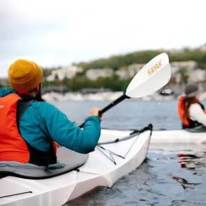 Kayaker with 4 piece kayak paddle by Oru kayak. Available at Riverbound Sports shop in Tempe, Arizona.