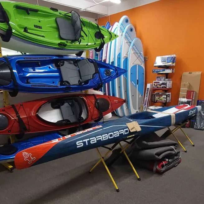 The Riverbound shop picture of Starboard Sprint racing SUP and Eddyline Kayaks.