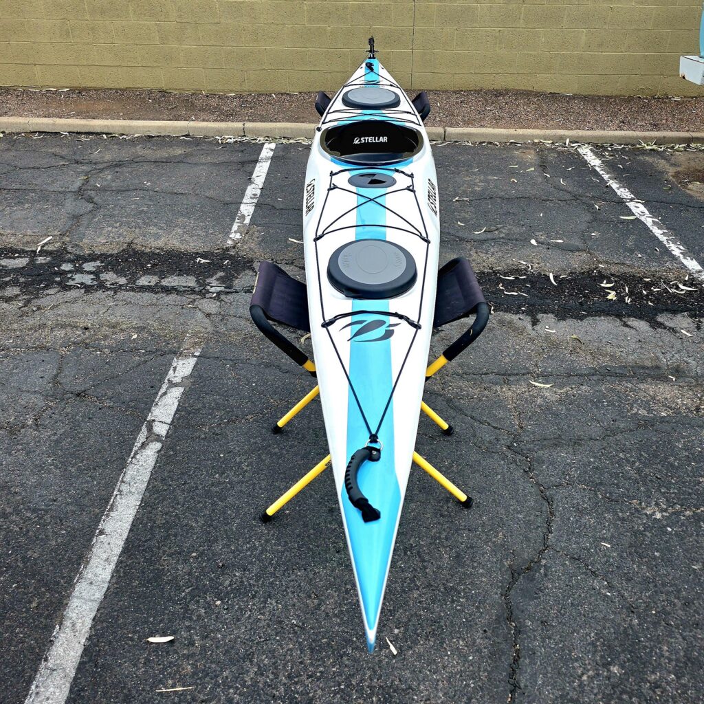 Stellar S16 G3 touring Kayak in teal and white.