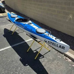 Blue and white Stellar S14 G2 kayak on stands. Available at Riverbound Sports in Tempe, Arizona.