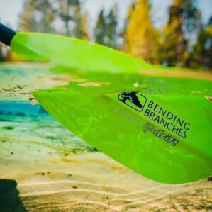 Bending Branches Drift Angler Paddle in electric green lifestyle blade in the water. Available at Riverbound Sports Paddle Company in Tempe, Arizona.