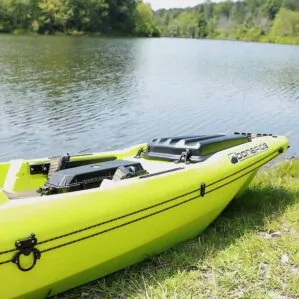 Bright green Bonafide kayak on lakeshore equipped with the YakAttack Anchor Trolly from Riverbound Sports in Tempe, Arizona.