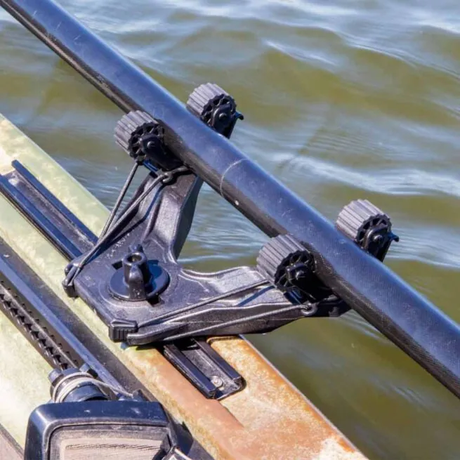 YakAttack black Doubleheader kayak paddle holder with paddle shaft on a kayak. Available at Riverbound Sports in Tempe, Arizona.