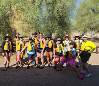 Group wearing life jackets ready for outdoor adventure.