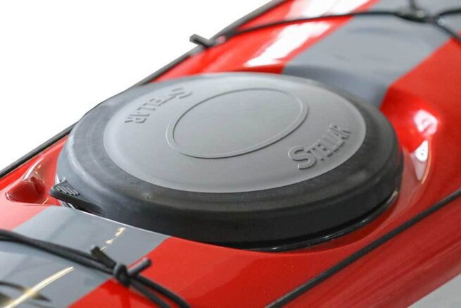 Red car's diesel fuel cap close-up.