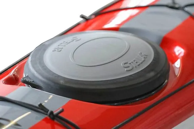 Red car's diesel fuel cap close-up.