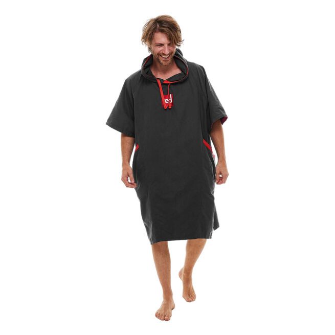 Man modeling gray Red Paddle Co hooded quick dry changing robe with red accents front view. Available at Riverbound Sports in Tempe, Arizona.
