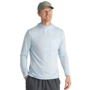 A man wearing the Free Fly Bamboo Long Sleeve Sun Hoody in blue bird color from the front. Available at Riverbound Sports.
