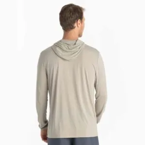 A man wearing the Free Fly Bamboo Long Sleeve Sun Hoody in sandstone color from the back. Available at Riverbound Sports.