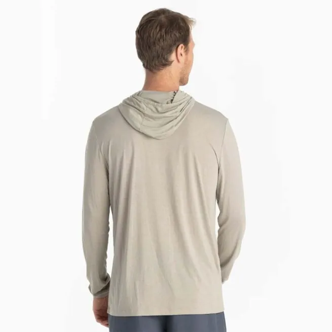 A man wearing the Free Fly Bamboo Long Sleeve Sun Hoody in sandstone color from the back. Available at Riverbound Sports.