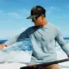 A man on the water wearing the Free Fly Lightweight Bamboo Long Sleeve Sun shirt from Riverbound Sports.
