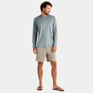 A man wearing the Free Fly Bamboo Long Sleeve Sun Shirt in slate blue from the front. Available at Riverbound Sports.