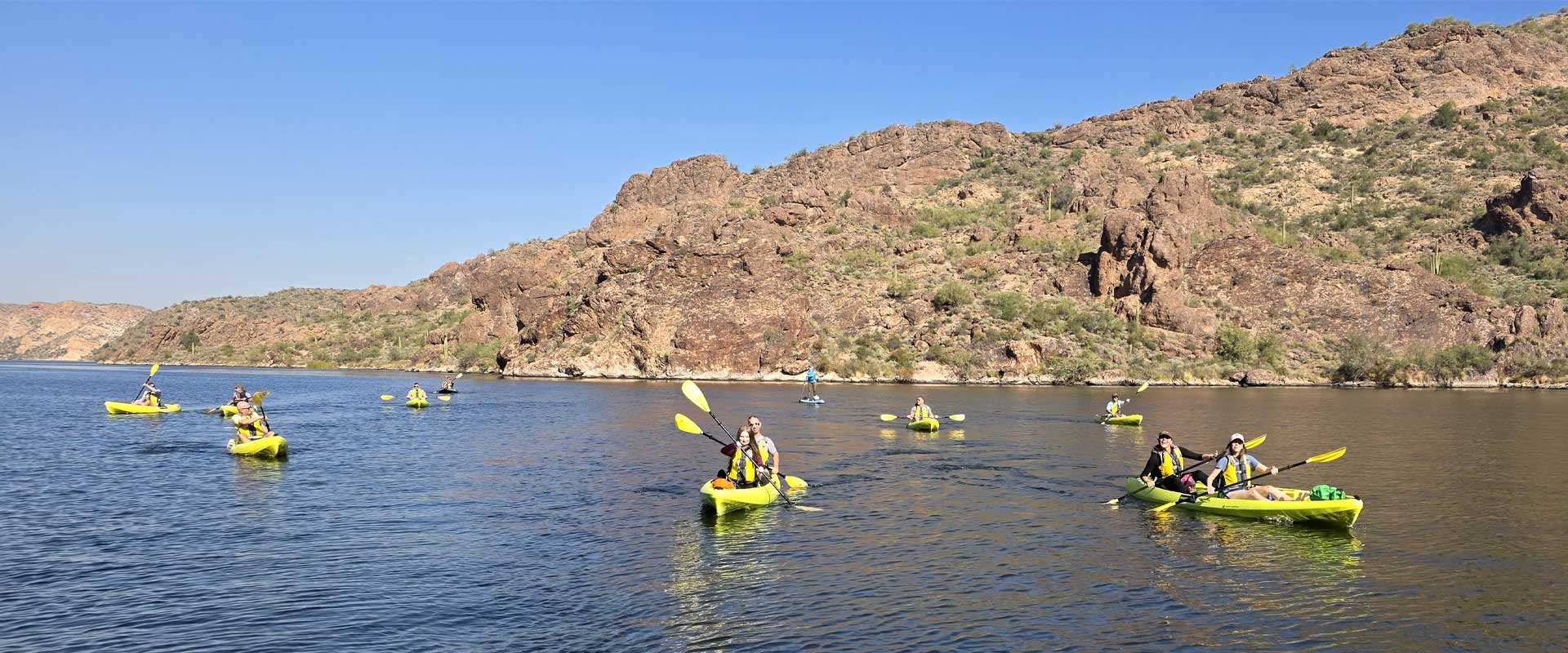 A Riverbound SPorts Premium kayaking Tour on Saguaro Lake with the Arizona Desert in the background